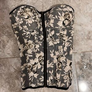 Vintage corset top makes bust look very good! Great condition